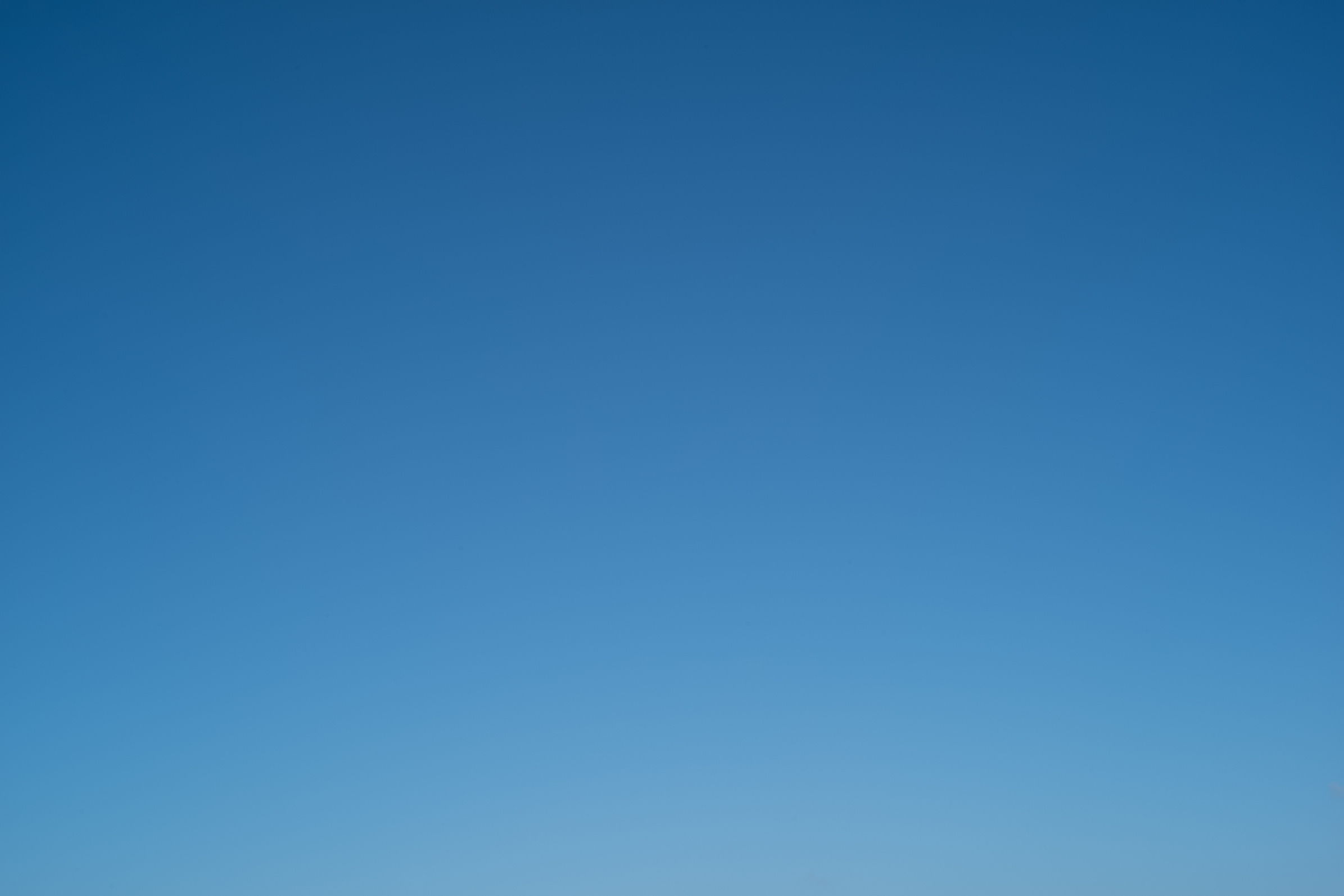 plain blue sky background